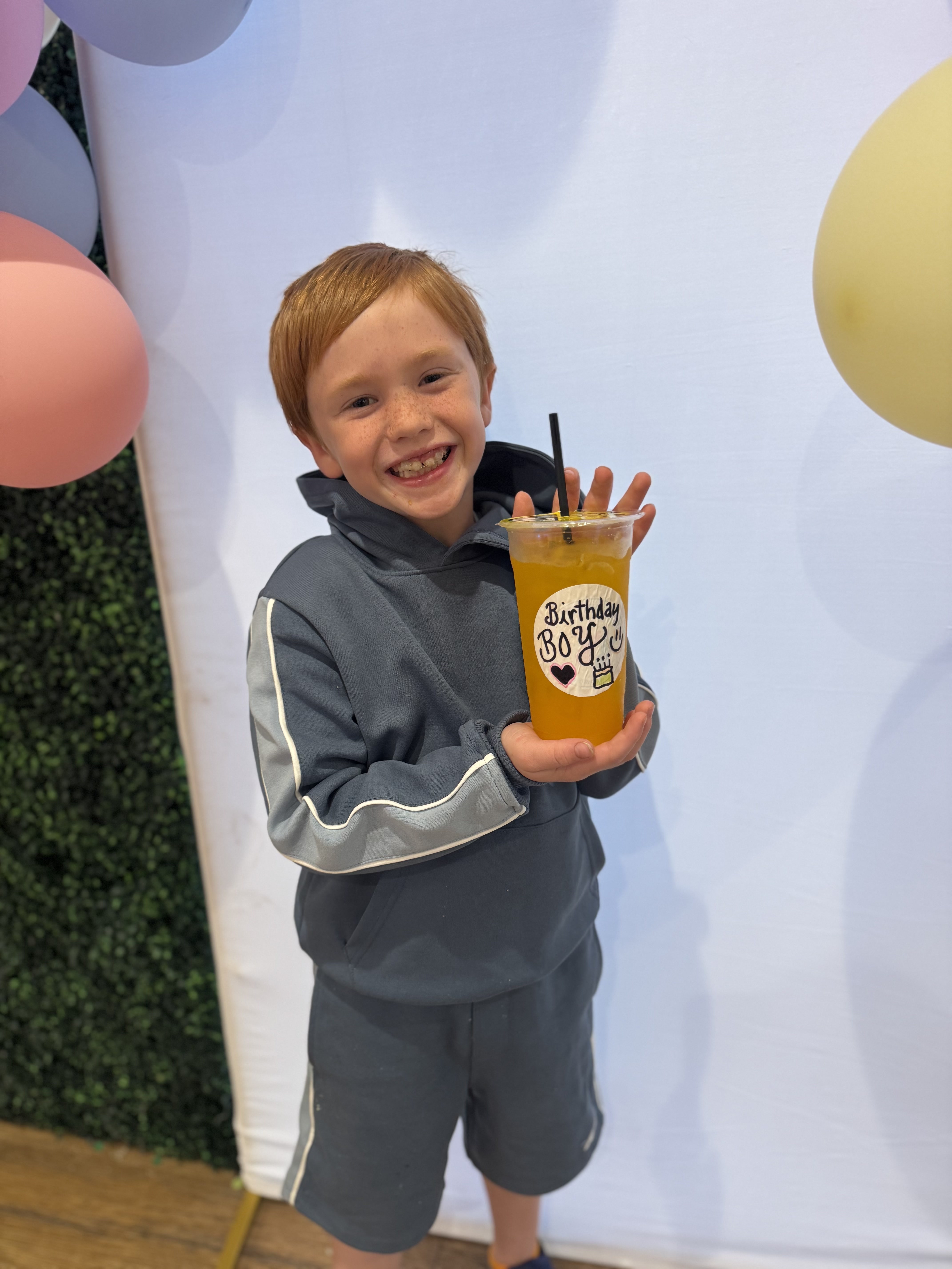 Birthday boy celebrating with a Wolf Nutrition drink